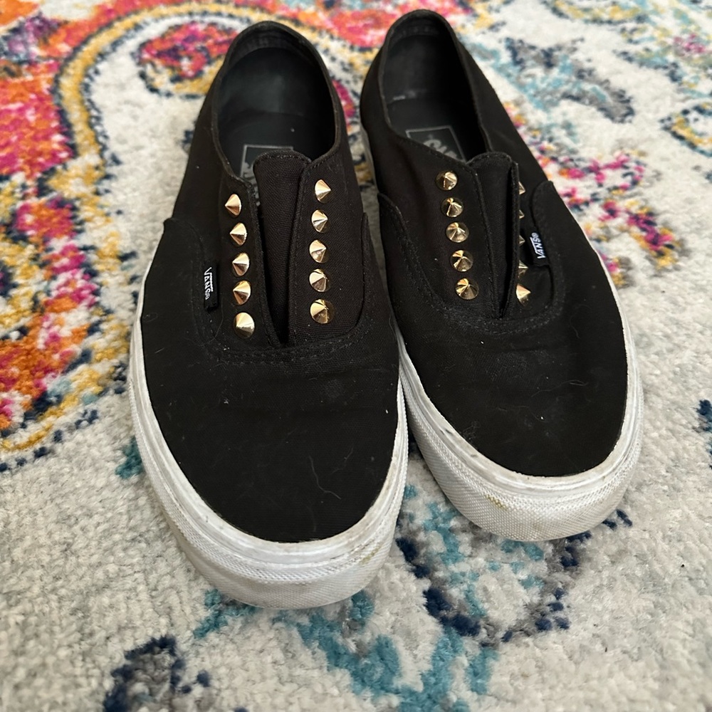 Gold Studded black vans.